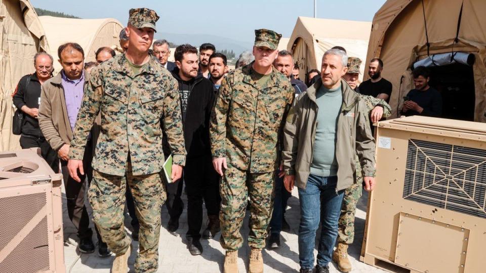Brig. Gen. Andrew T. Priddy, leaders from Task Force 61/2, and members of the Turkish Ministry of Health walk through the field hospital at Antakya, Turkey, on March 2, 2023. (Sgt. James Bourgeois/Marine Corps)
