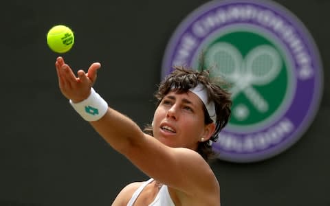 Suarez Navarro serves - Credit: AP