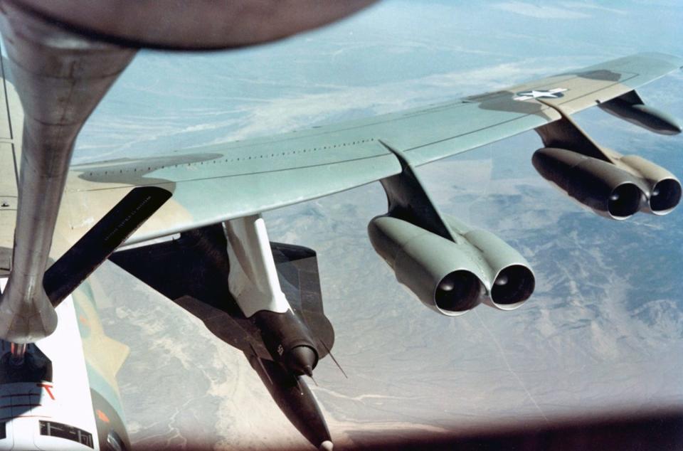 A B-52H bomber carries the D-21B. A rocket booster provided the acceleration to start the drone's ramjet engine.