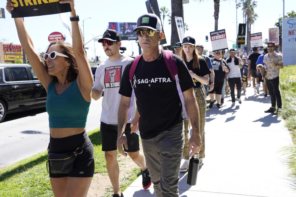 Actor Dermot Mulroney takes part in a rally by striking writers and actors outside Netflix studio in Los Angeles on Friday, July 14, 2023. This marks the first day actors formally joined the picket lines, more than two months after screenwriters began striking in their bid to get better pay and working conditions. (AP Photo/Chris Pizzello)