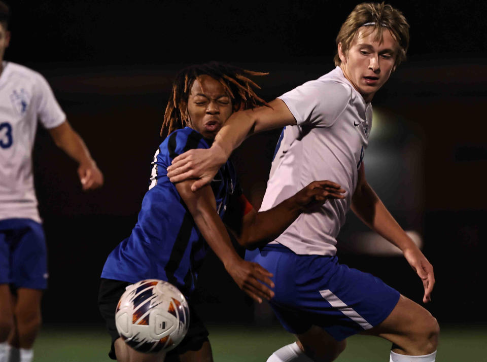 Wyoming's Levi Gause (13) battles Bexley's Sam Lessard (8) for the ball during their state semifinal Wednesday, Nov. 9, 2022