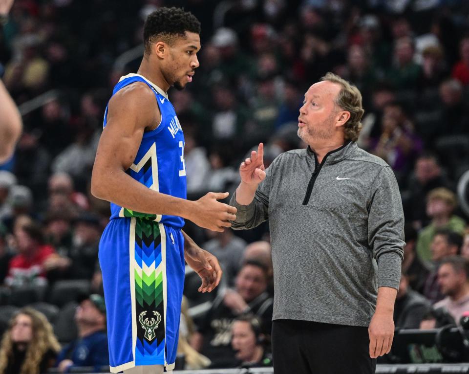 Milwaukee Bucks forward Giannis Antetokounmpo (34) talks to head coach Mike Budenholzer in the first quarter during a game against the Chicago Bulls at Fiserv Forum in Milwaukee on Nov. 23, 2022.