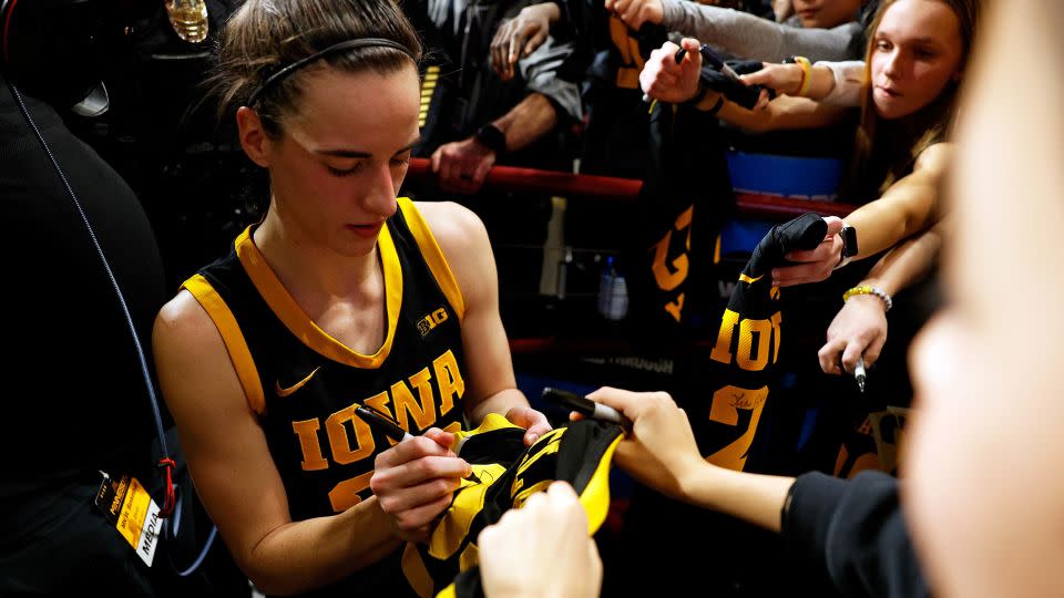 Caitlin Clark signs autographs for fans after the game against the Minnesota Golden Gophers at Williams Arena on February 28, 2024 in Minneapolis, Minnesota. - David Berding/Getty Images