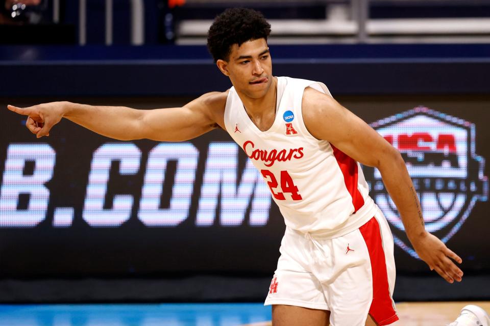 Houston Cougars guard Quentin Grimes (24) points after sinking a three-pointer against Syracuse during the Sweet Sixteen round of the 2021 NCAA Tournament on Saturday, March 27, 2021, at Hinkle Fieldhouse in Indianapolis, Ind.