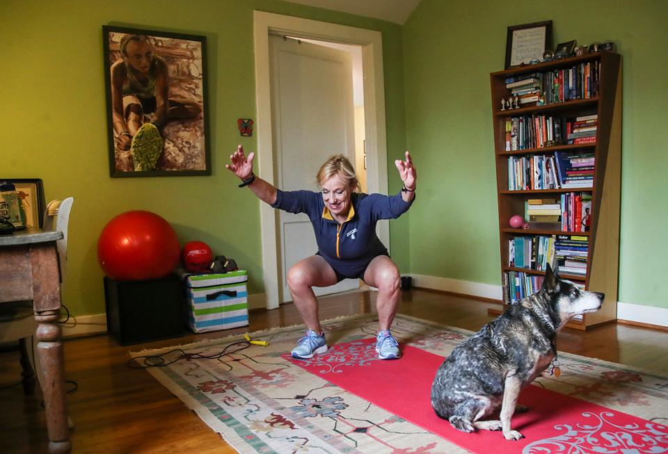 Kirby Adams works out at home during the coronavirus outbreak that has kept most of Kentuckians at home due to gyms being currently closed. March 18, 2020.