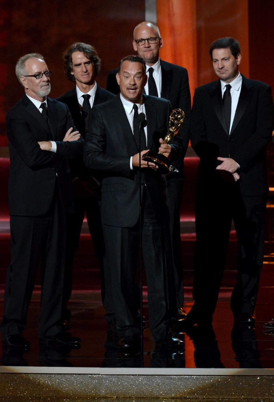 <p>Tom Hanks accepts the Emmy on behalf of the team behind the HBO political drama <em>Game Change</em>, for which he served as an executive producer.</p>