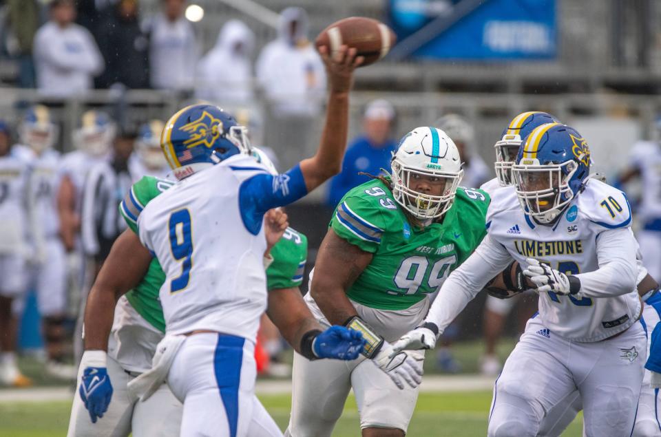 West Florida's Pooda Walker (99) goes after Limestone quarterback Dustin Noller (9) during first round of the 2022 NCAA Division II Football Championship against the Limestone Saints at Pen Air Field Saturday, November 19, 2022.. West Florida went on to beat Limestone 45-19.