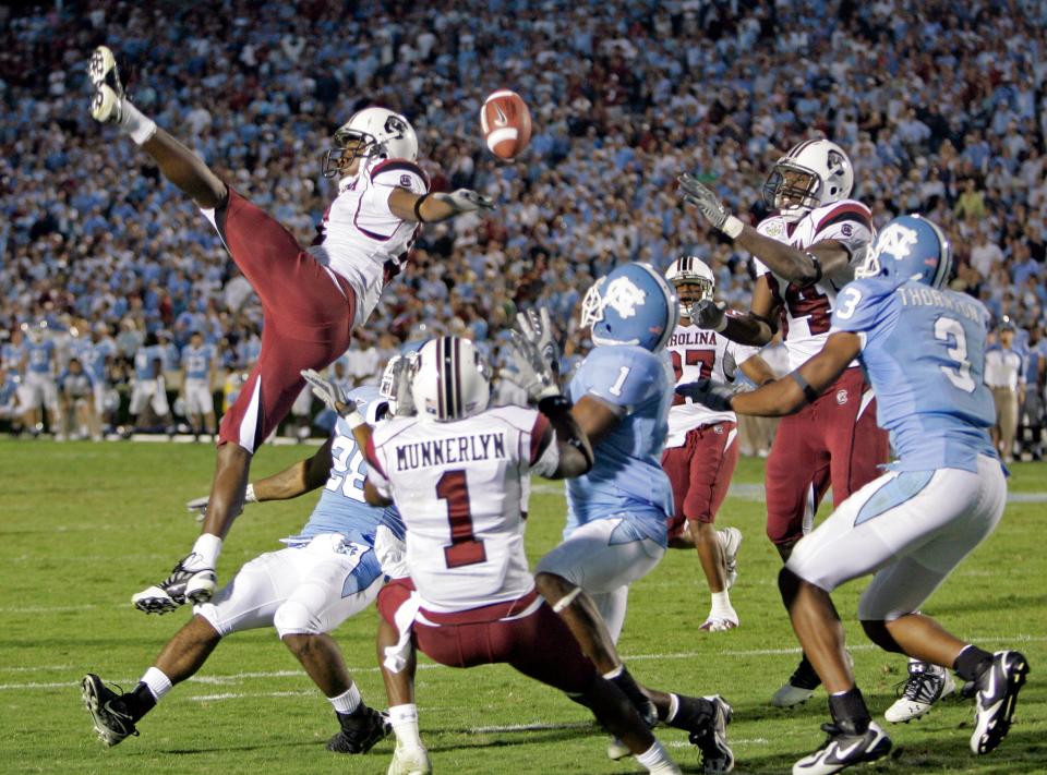 South Carolina's Kenny McKinley, top left, breaks up a pass on the final play of the game during the second half of a college football game against  North Carolina in Chapel Hill, N.C., Saturday, Oct. 13, 2007. South Carolina won, 21-15. (AP Photo/Gerry Broome)