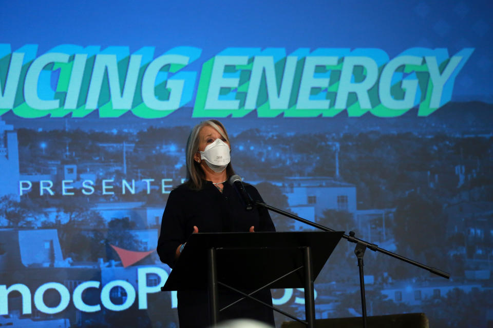 Democratic Gov. Michelle Lujan Grisham addresses energy executives at the New Mexico Oil And Gas Association meeting on Monday, Oct. 4, 2021, in Santa Fe, New Mexico. Lujan Grisham has moved to crack down on pollution from gas extraction while also trying to shield the state's producers from a drilling moratorium by the Biden administration. New Mexico relies on oil and gas royalties for around one third of its budget. (AP Photo/Cedar Attanasio)