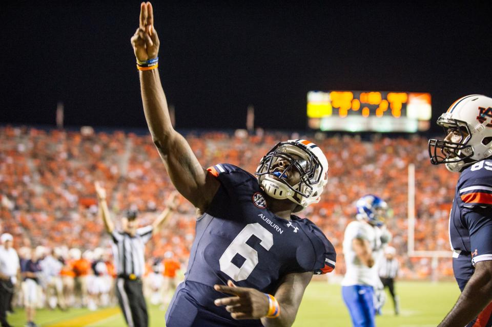 AUBURN, AL - SEPTEMBER 6: Quarterback Jeremy Johnson #6 of the Auburn Tigers points to the crowd after scoring a touchdown during their game against the San Jose State Spartans on September 6, 2014 at Jordan-Hare Stadium in Auburn, Alabama. Auburn defeated San Jose State 59-13. (Photo by Michael Chang/Getty Images)