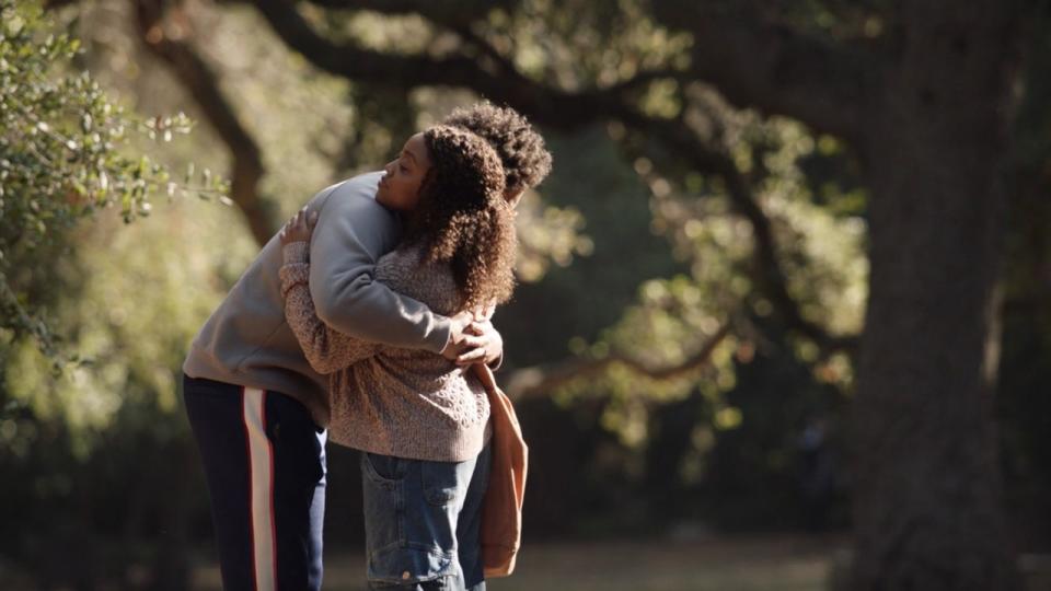 Janine and Tariq hugging in Abbott Elementary