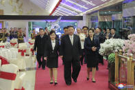 In this photo provided by the North Korean government, North Korean leader Kim Jong Un, center, with his wife Ri Sol Ju, right, and his daughter attend a feast to mark the 75th founding anniversary of the Korean People’s Army at an unspecified place in North Korea Tuesday, Feb. 7, 2023. Independent journalists were not given access to cover the event depicted in this image distributed by the North Korean government. The content of this image is as provided and cannot be independently verified. Korean language watermark on image as provided by source reads: "KCNA" which is the abbreviation for Korean Central News Agency. (Korean Central News Agency/Korea News Service via AP)