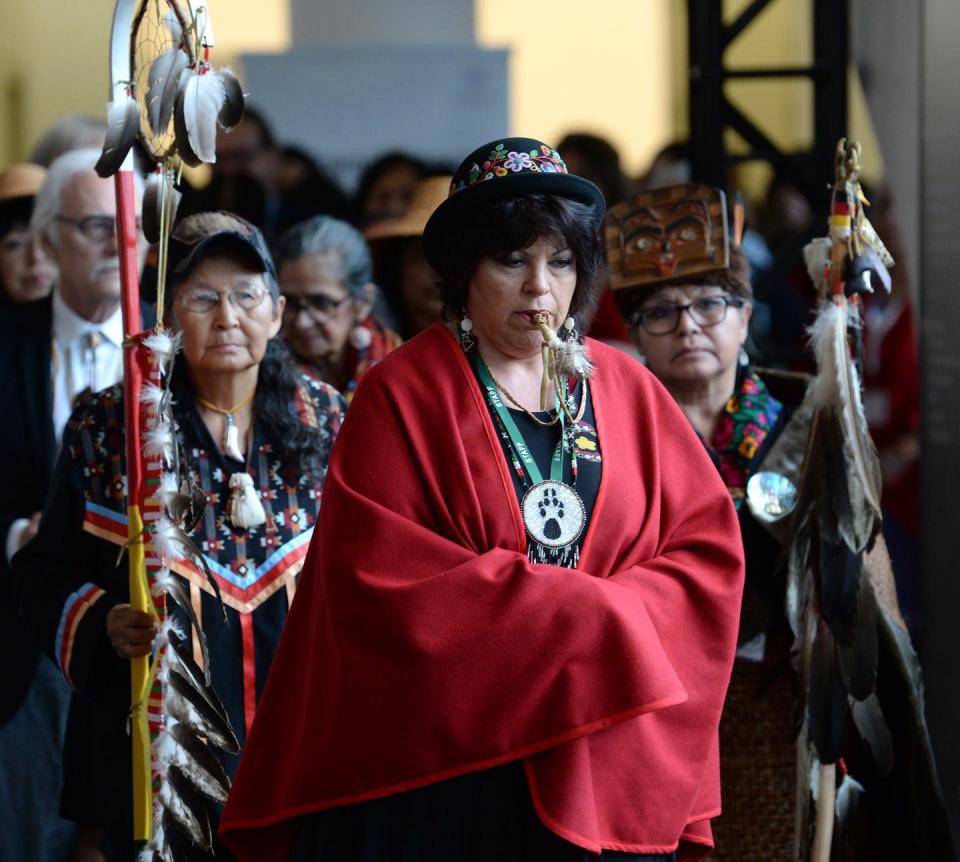 The opening procession is shown at the closing ceremony for the National Inquiry into Missing and Murdered Indigenous Women and Girls in Gatineau, Que., on June 3, 2019. THE CANADIAN PRESS/Adrian Wyld