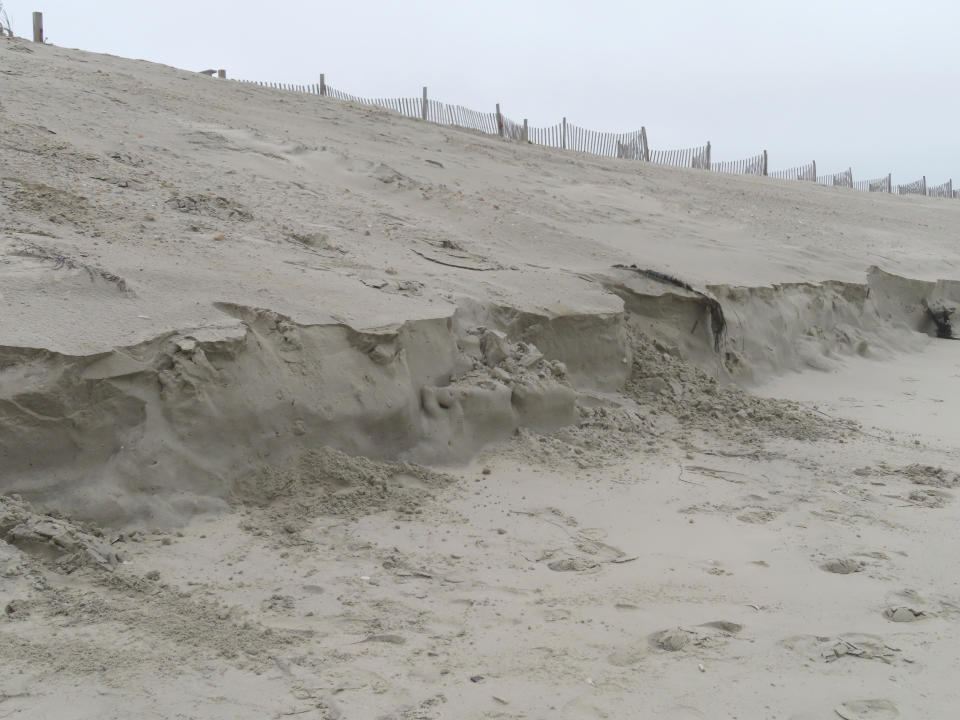 New erosion is already apparent on Tuesday, Oct. 25, 2022, in a beach restored a week earlier in North Wildwood, N.J. The town used bulldozers to push sand back into piles to repair severe erosion from recent storms, despite a directive from state environmental officials not to do the work until the proper studies and planning took place. (AP Photo/Wayne Parry)