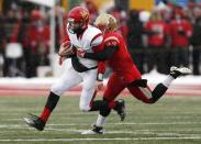 Laval Rouge et Or Michael Langlois (R) sacks Calgary Dinos quarterback Andrew Buckley during the Vanier Cup University Championship football game in Quebec City, Quebec, November 23, 2013. REUTERS/Mathieu Belanger (CANADA - Tags: SPORT FOOTBALL)