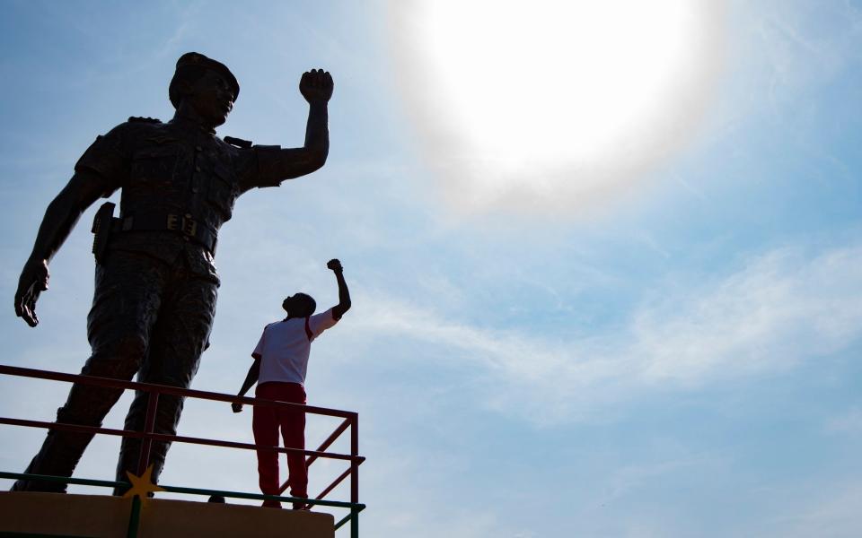 Tourists at the memorial to murdered President Thomas Sankara. Ouagadougou. -  Simon Townsley/The Telegraph