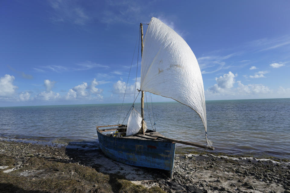 A recently arrived rustic boat sits on the shore, Wednesday, Jan. 4, 2023, in Islamorada, Fla. More than 500 Cuban immigrants have come ashore in the Florida Keys since the weekend, the latest in a large and increasing number who are fleeing the communist island. (AP Photo/Wilfredo Lee)