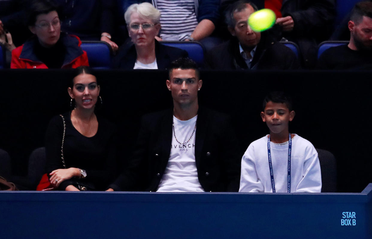 Tennis – ATP Finals – The O2, London, Britain – November 12, 2018 Juventus’ Cristiano Ronaldo and family watch the group stage match between Serbia’s Novak Djokovic and John Isner of the U.S. Action Images via Reuters/Andrew Couldridge