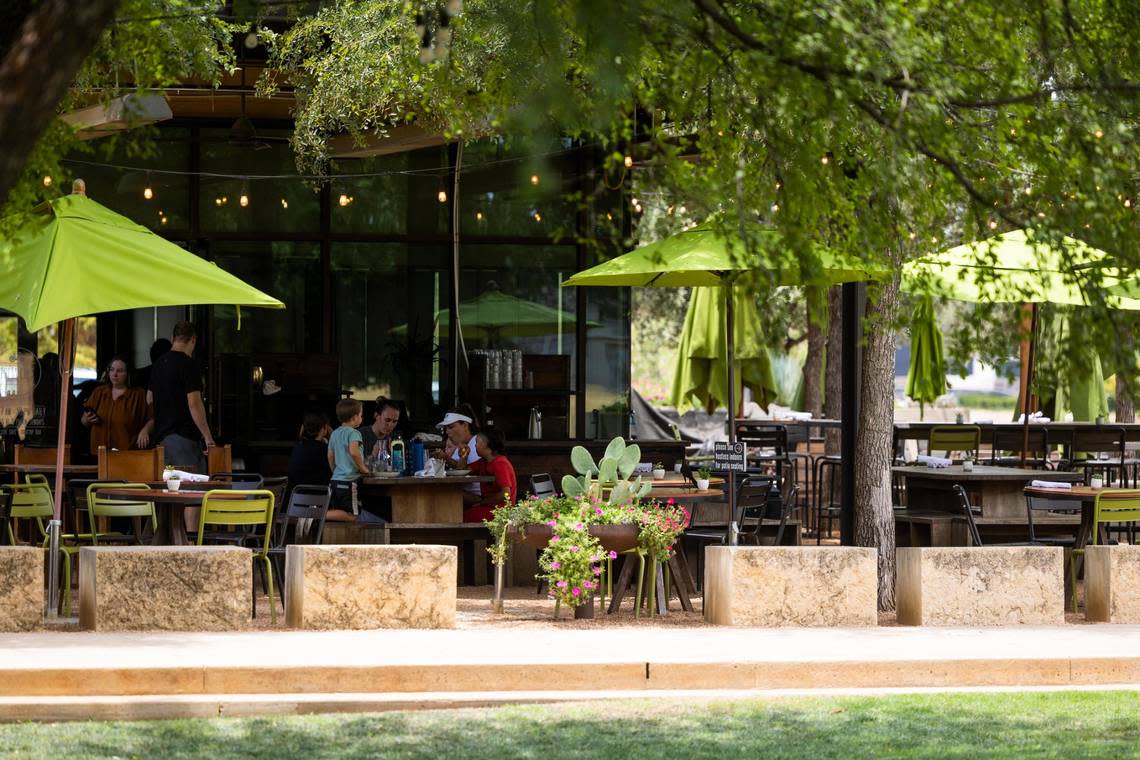 People dine at the patio as temperatures rise above 100 degrees Thursday, July 21, 2022, at Press Cafe in Fort Worth.