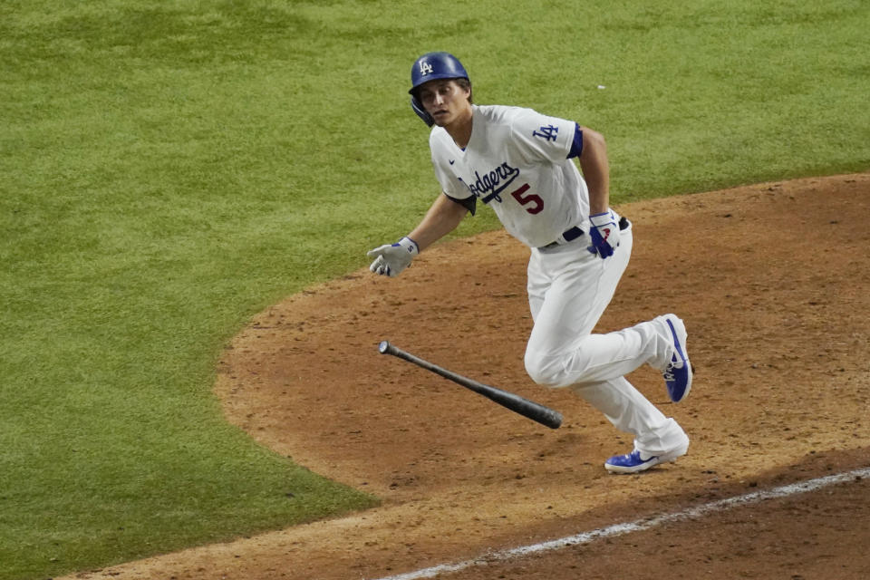 Los Angeles Dodgers' Corey Seager watches his home run against the Tampa Bay Rays during the eighth inning in Game 2 of the baseball World Series Wednesday, Oct. 21, 2020, in Arlington, Texas. (AP Photo/Sue Ogrocki)