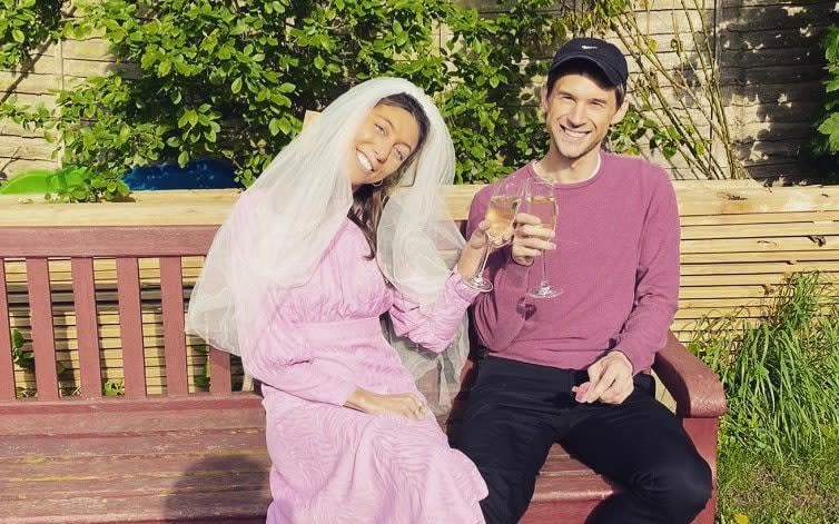 Anna Silverman and her fiancé Adrian sharing a glass of champagne on her alternative wedding day 