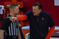 Illinois head coach Brad Underwood argues a call during the first half of an NCAA college basketball game against the Wisconsin Saturday, Feb. 27, 2021, in Madison, Wis. (AP Photo/Morry Gash)
