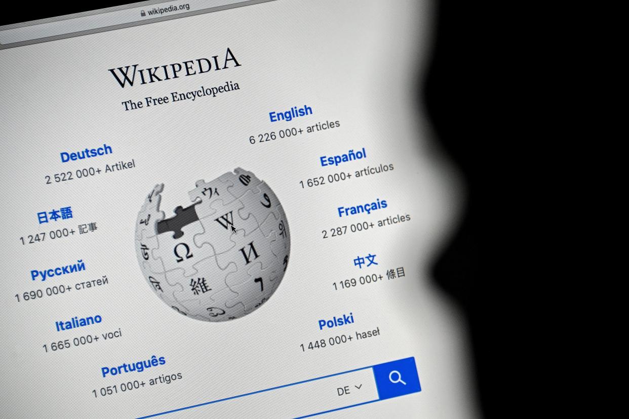A close-up image shows the front page of the Wikipedia online encyclopedia on a mobile computer, in Cologne, Germany, 13 January 2021 (EPA)