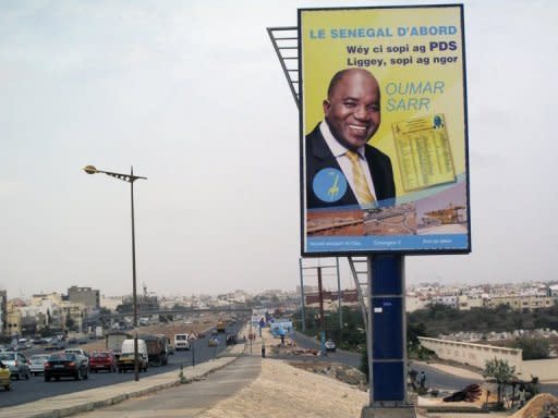 A bilboard shows a campaign advertisement for Oumar Sarr of the Democratic Party of Senegal (PDS) in the upcoming legislative elections in Dakar. Senegal voted for a new parliament with President Macky Sall seeking a majority to put his policies into action after ousting the veteran former leader Abdoulaye Wade in a March poll