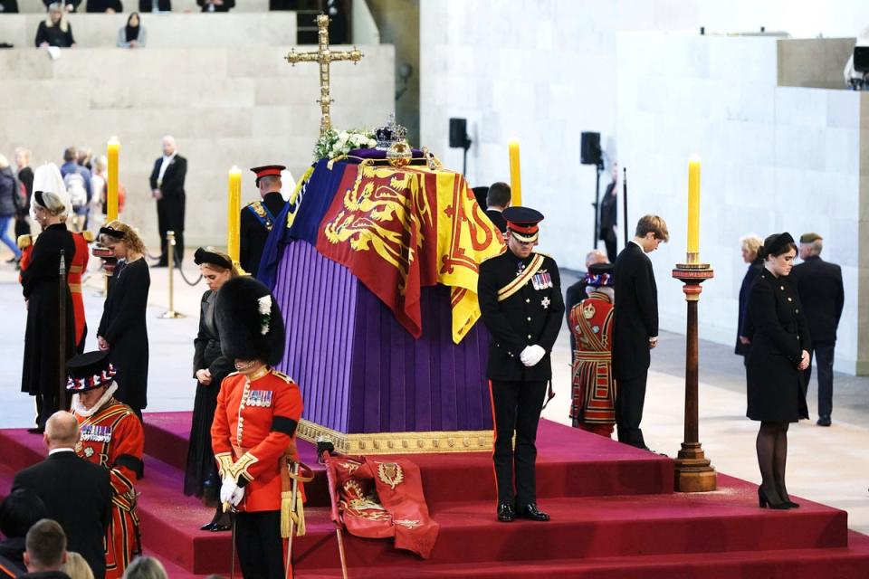 Prince Harry,  Princess Beatrice, Lady Louise, Zara Tindall, Prince William, the Prince of Wales, Peter Phillips, Viscount James Severn and Princess Eugenie, bow, during the vigil of the Queen’s grandchildren, as they stand by the coffin of Queen Elizabeth II, as it lies in state, in Westminster Hall (Aaron Chown/Pool via AP)