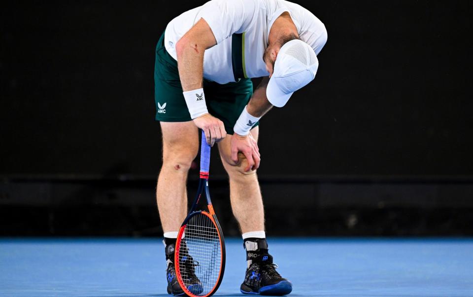 An exhausted Andy Murray of Great Britain reacts during his second round match against Thanasi Kokkinakis of Australia at the 2023 Australian Open - Shutterstock /Lukas Coch