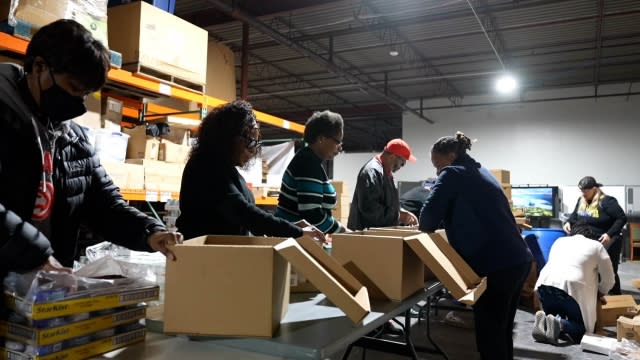 Volunteers packing Thanksgiving meals to seniors in the Atlanta community and others in need.