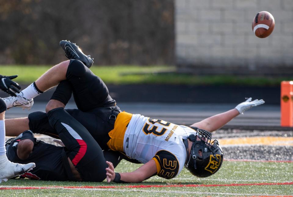 Thomas Jefferson's Jordan Mayer loses the ball in a tangle with Aliquippa players during a WPIAL Class 4A championship game in 2020. The former Wisconsin Badger is transferring to Penn State after just one year in Madison.