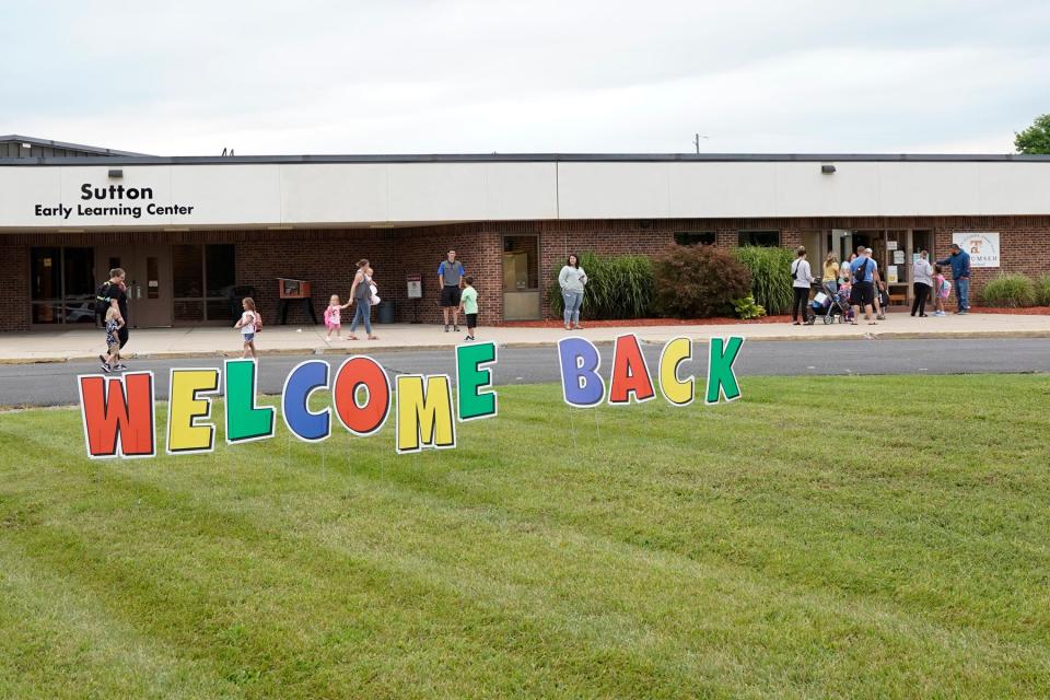 Yard decorations welcome students at Tecumseh's Sutton Early Learning Center back to school on their first day of classes Wednesday.