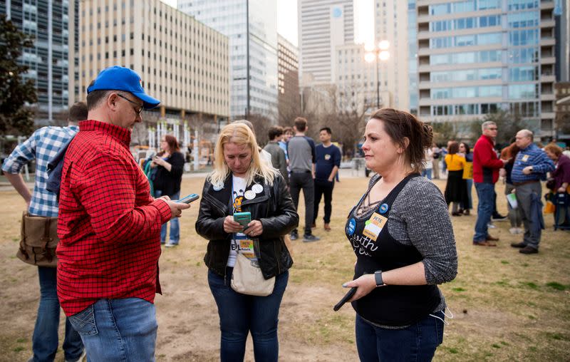 Supporters react to reports of Democratic 2020 U.S. presidential candidate former South Bend, Indiana Mayor Pete Buttigieg suspending his candidacy as they gather before a rally in Dallas