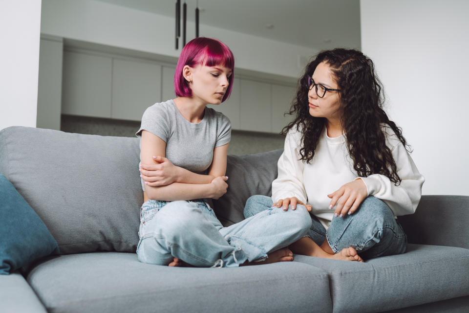 two people talking on the couch