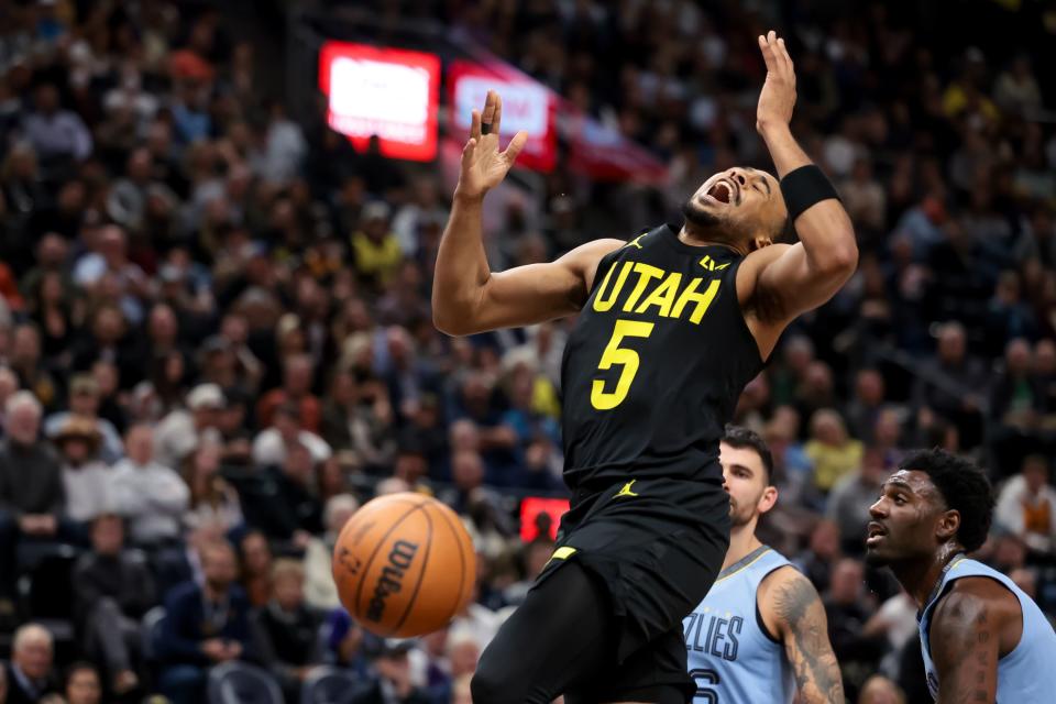 Utah Jazz guard <a class="link " href="https://sports.yahoo.com/nba/players/6234" data-i13n="sec:content-canvas;subsec:anchor_text;elm:context_link" data-ylk="slk:Talen Horton-Tucker;sec:content-canvas;subsec:anchor_text;elm:context_link;itc:0">Talen Horton-Tucker</a> (5) loses the ball on the way to the hoop during the game against the Memphis Grizzlies at the Delta Center in Salt Lake City on Wednesday, Nov. 1, 2023. | Spenser Heaps, Deseret News