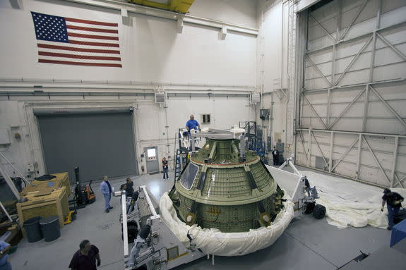 At NASA’s Kennedy Space Center in Florida, Lockheed Martin crews uncover the Orion ground test vehicle in the Launch Equipment Test Facility, or LETF.