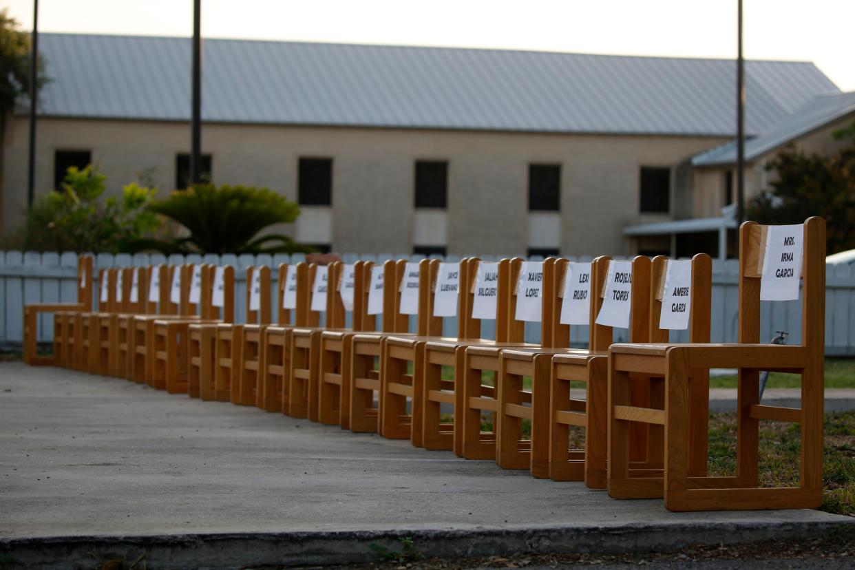 Twenty-one empty chairs are seen outside of a day care center as a memorial for the victims killed earlier in the week in the elementary school shooting in Uvalde, Texas.