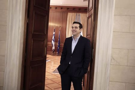 Greek Prime Minister Alexis Tsipras is seen before his meeting with the member of the European Parliament for The Greens Ska Keller (not pictured) at this office in Athens February 27, 2015. REUTERS/Petros Giannakouris/Pool