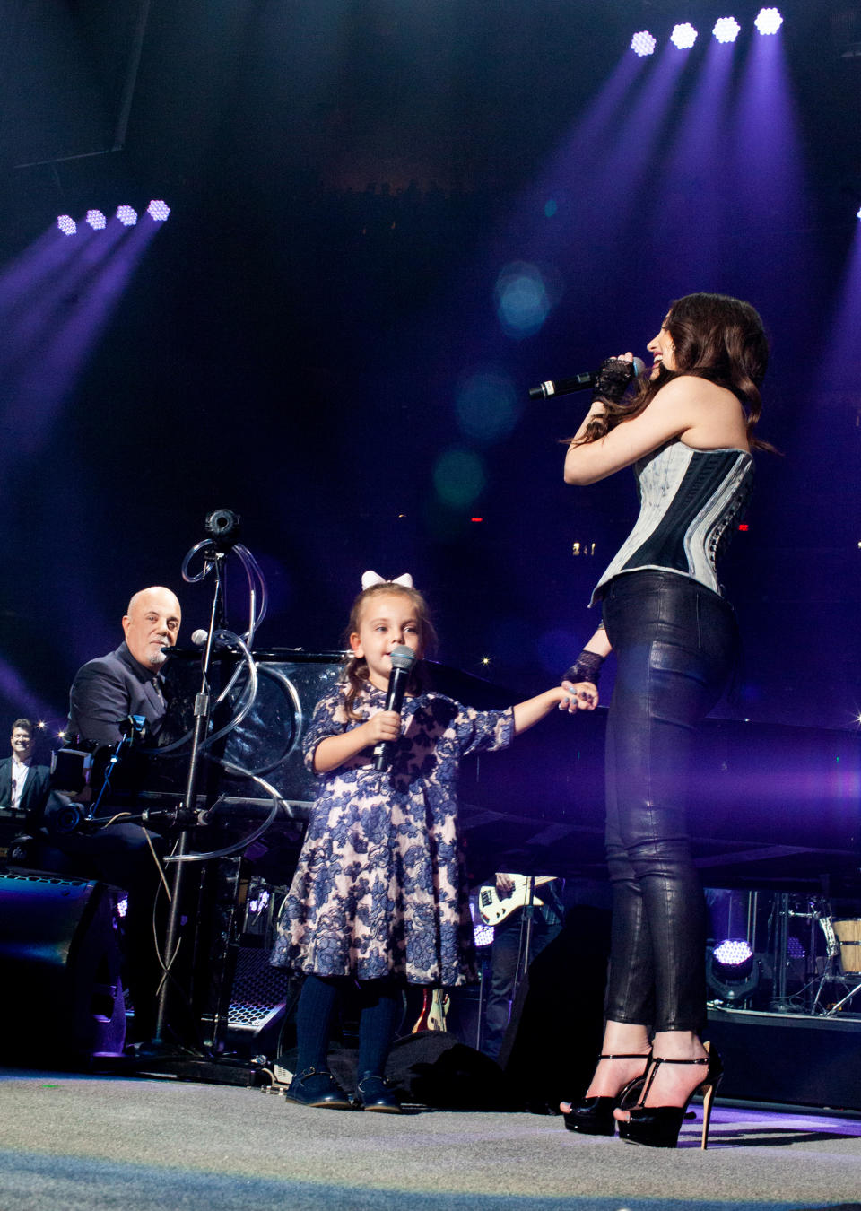 Billy Joel joined onstage by daughters Della Rose and Alexa Ray in 2019 (Myrna M. Suarez / Getty Images)