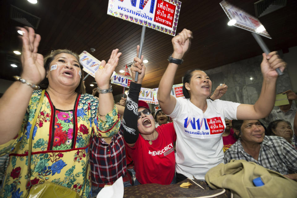 Supporters of Pheu Thai party cheer while watching television election results, at party headquarters in Bangkok, Thailand, Sunday, March 24, 2019. Voting stations are closed and meaningful results are expected within hours, although many commentators suggest the formation of a new government could take weeks of haggling. (AP Photo/Wason Wanichakorn)