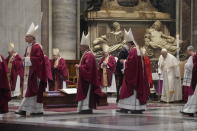 Pope Francis stands as cardinals and bishops leave after the funeral ceremony for Australian Cardinal George Pell in St. Peter's Basilica, at the Vatican, Saturday Jan. 14, 2023. Cardinal Pell died on Tuesday at a Rome hospital of heart complications following hip surgery. He was 81. (AP Photo/Gregorio Borgia)