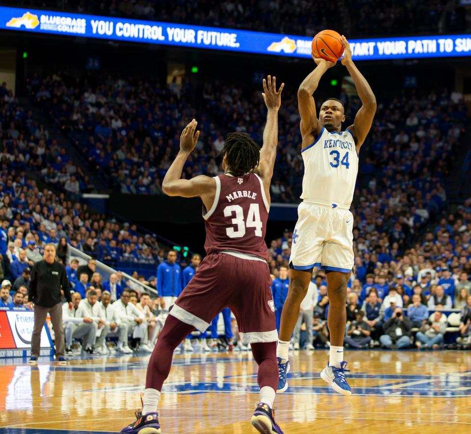 Kentucky forward Oscar Tshiebwe (34) scores agains the Aggies' defense during first half action as the Wildcats faced off against Texas A&M at Rupp Arena on Saturday afternoon. Jan. 21, 2023