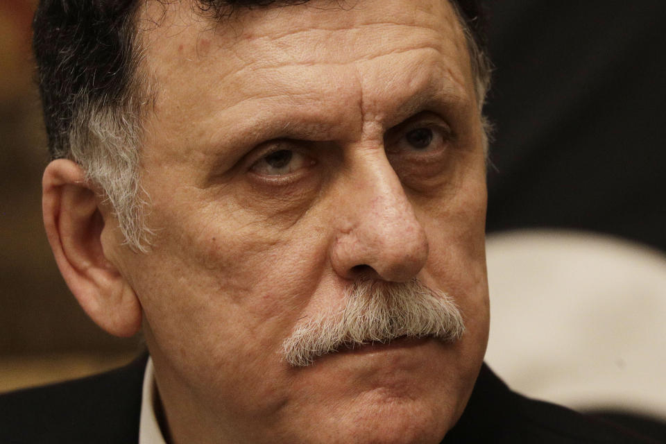 Libya's Prime Minister Fayez al-Sarraj holds a press conference after his meeting with Italian Premier Giuseppe Conte at Chigi palace, in Rome, Saturday, Jan. 11, 2020. (AP Photo/Gregorio Borgia)