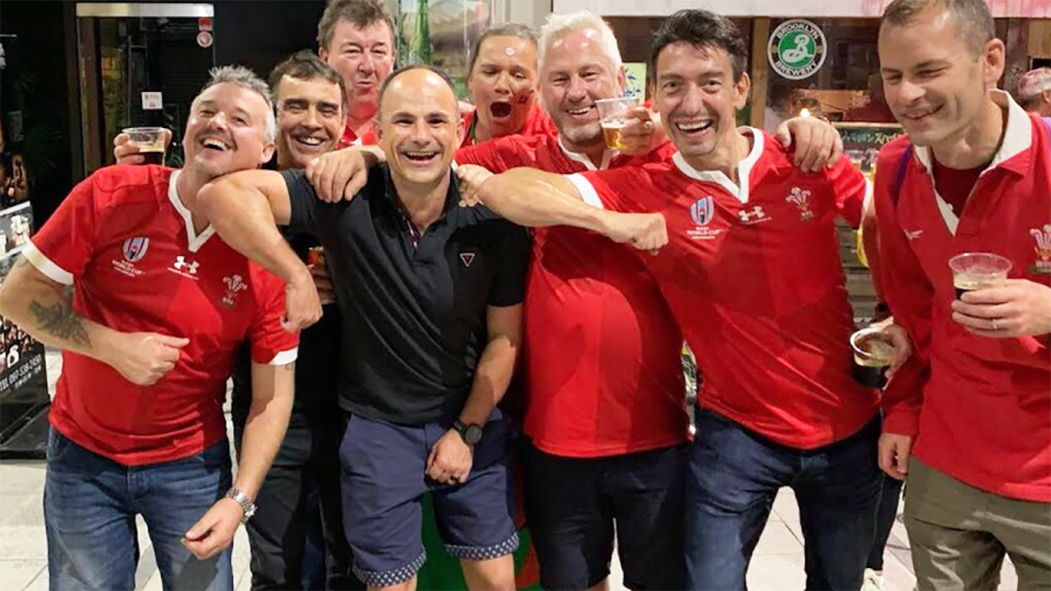 Jaco Peyper, pictured here posing with Welsh fans at the Rugby World Cup.