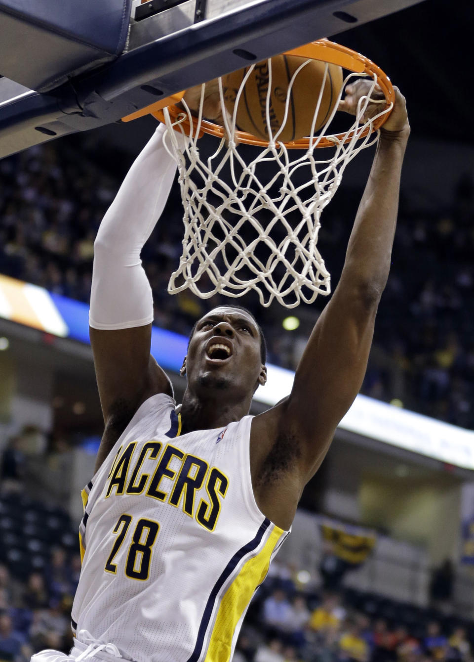 Indiana Pacers center Ian Mahinmi dunks in the second half of an NBA basketball game against the Denver Nugget in Indianapolis, Monday, Feb. 10, 2014. The Pacers won 119-80. (AP Photo/Michael Conroy)