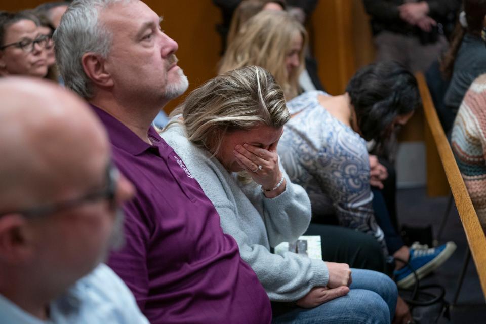 Craig Shilling, father of Justin Shilling, left, sits with Steve St. Juliana, father of Hana St. Juliana, and Nicole Beausoleil, mother of Madisyn Baldwin, who is overcome by emotion as James Crumbley is found guilty on four counts of involuntary manslaughter for the deaths of their children in the Oakland County courtroom of Judge Cheryl Matthews on Thursday, March, 14, 2024. Crumbley's son perpetrated a mass shooting killing four students in 2021 at Oxford High School.