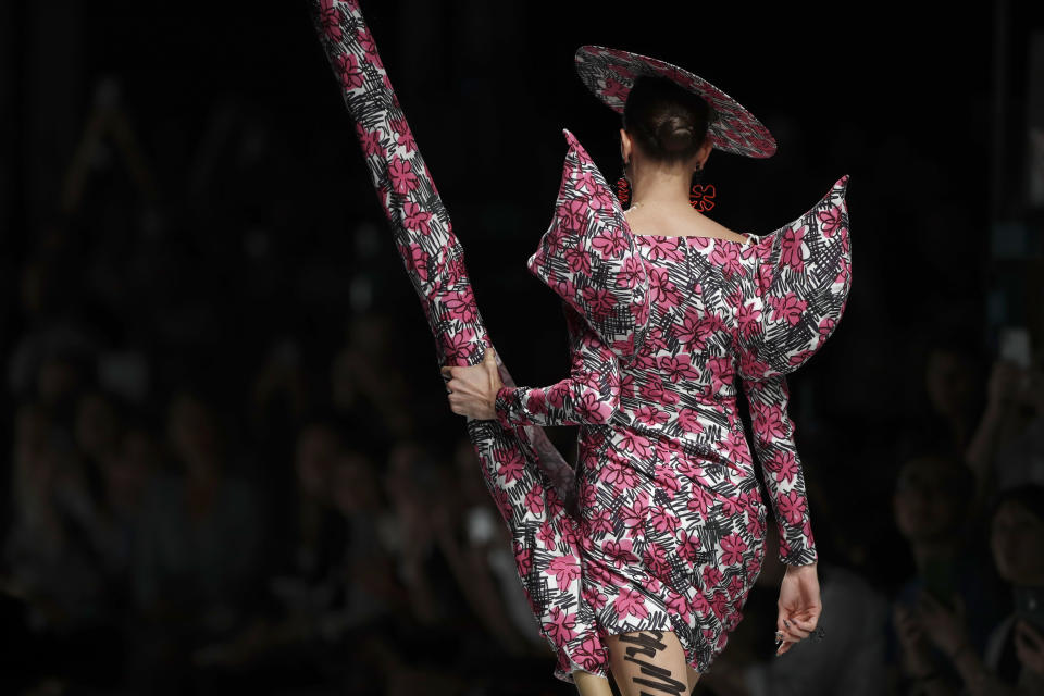 A model wears a creation as part of the Moschino women's 2019 Spring-Summer collection, unveiled during the Fashion Week in Milan, Italy, Thursday, Sept. 20, 2018. (AP Photo/Antonio Calanni)