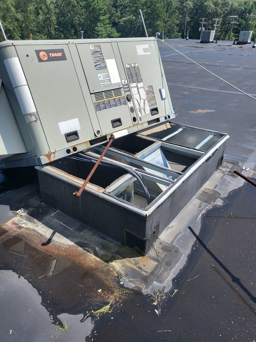 Mattapoisett Town Administrator Michael Lorenco said Monday's tornado ripped this heavy HVAC unit from the roof of the town's water treatment plant.
