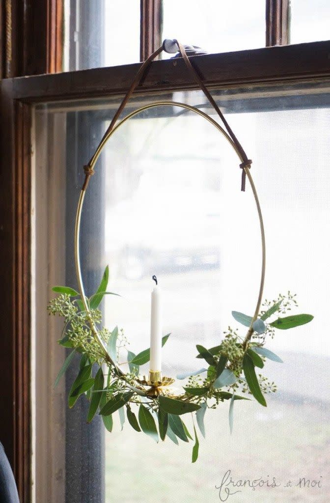 <p>Candles are a fixture in windows around the holidays, but we think you should put a new spin on the look. This metal hoop wreath will do just that.</p><p><strong>Get the tutorial at <a href="https://francoisetmoi.com/diy/candle-wreath/" rel="nofollow noopener" target="_blank" data-ylk="slk:François et Moi" class="link ">François et Moi</a>.</strong></p><p><strong><a class="link " href="https://www.amazon.com/Darice-17160-17160Metal-Macrame-Ring-Gold-12/dp/B004BPV3D8/?tag=syn-yahoo-20&ascsubtag=%5Bartid%7C10050.g.23343056%5Bsrc%7Cyahoo-us" rel="nofollow noopener" target="_blank" data-ylk="slk:SHOP METAL HOOPS">SHOP METAL HOOPS</a><br></strong></p>